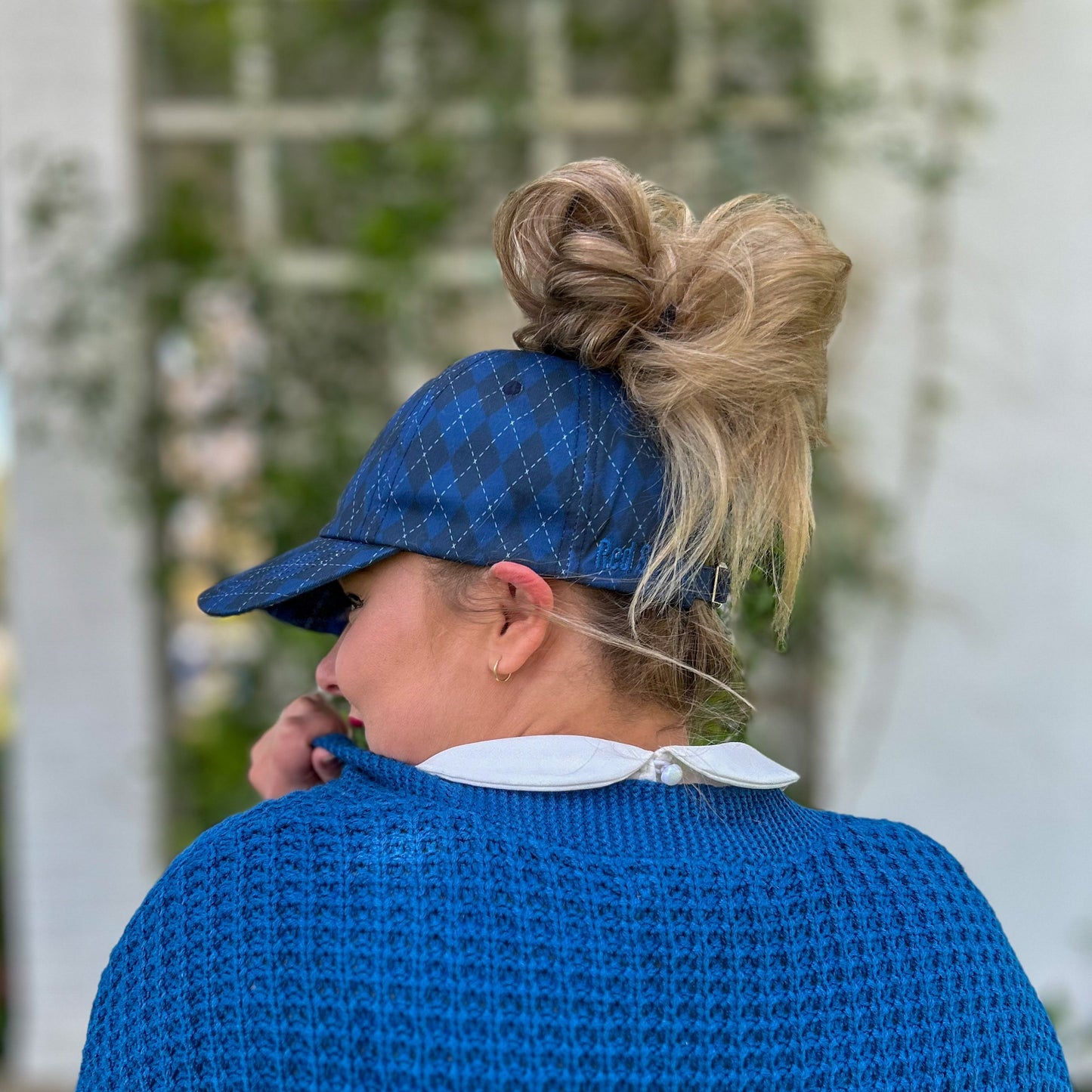 side view of blue argyle messy bun baseball cap, red sprite hats, harry potter ravenclaw house hat, women's harry potter hat, hogwarts house hat, potter bounding look, stylish messy bun hat