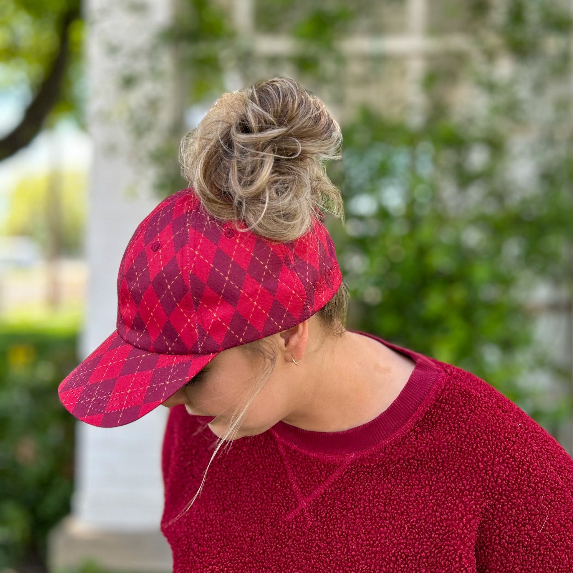 side view of red argyle messy bun baseball cap, harry potter ponytail cap, hogwarts house hat, universal studios, potter bounding women's hat, gryffindor baseball cap, women's harry potter house hat,