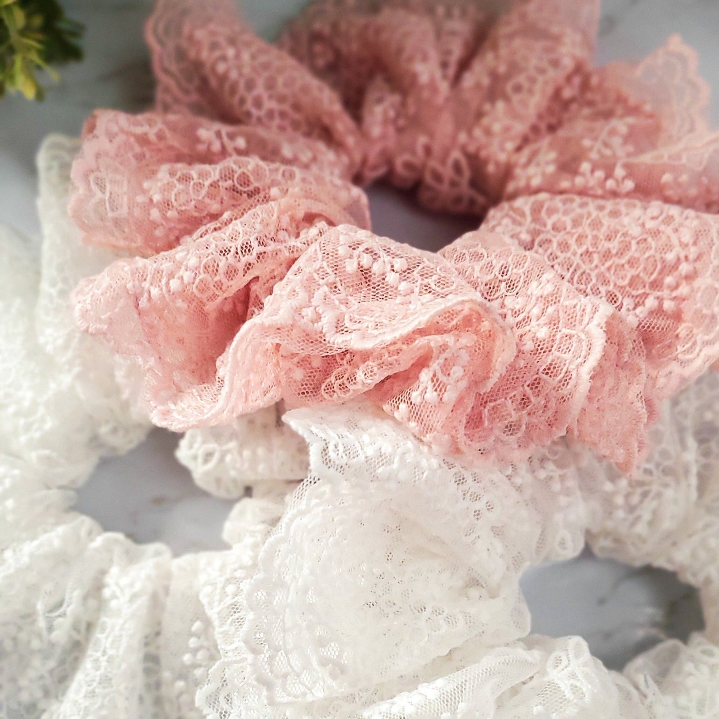 closeup of white and pink luxury lace scrunchies red sprite hats