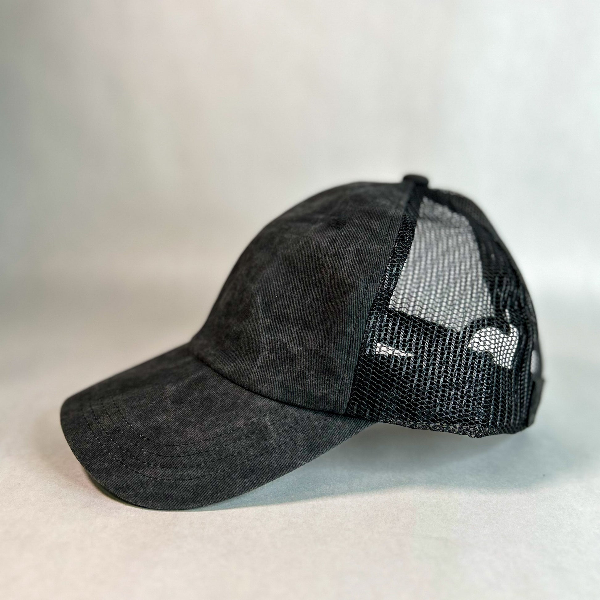 side view of red sprite hats ponytail cap washed black mesh back women's hat