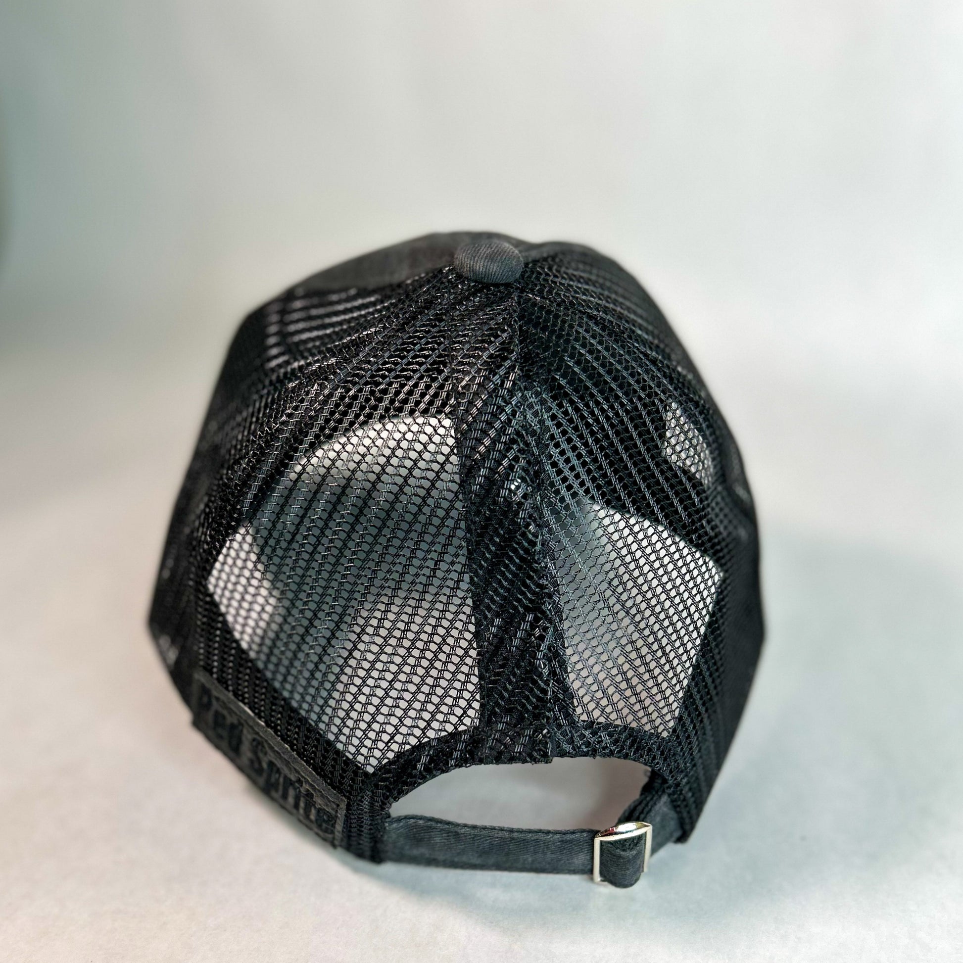 back view of hidden messy bun baseball cap, black mesh back women's hat
