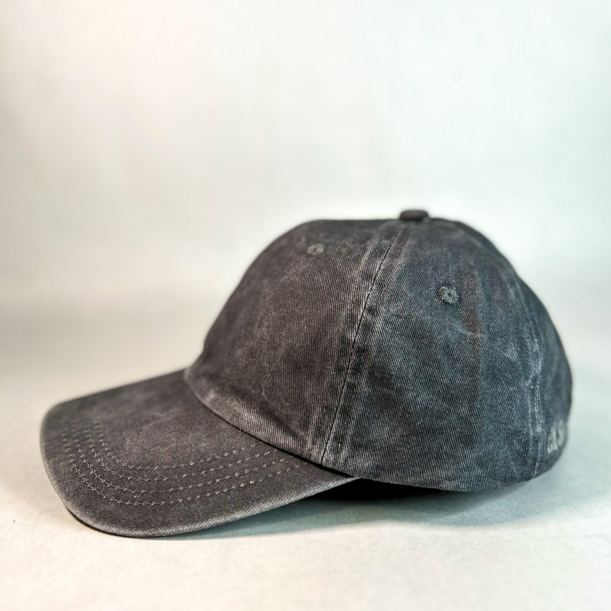 side view of red sprite hats hidden ponytail hat, dark grey women's baseball cap