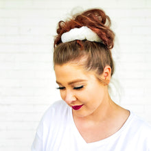 Load image into Gallery viewer, wearing fluffy white on cloud 9 scrunchy with messy bun red sprite hats
