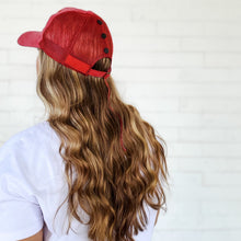 Load image into Gallery viewer, back view of red sprite hats red messy bun baseball cap with black snaps and long curly hair
