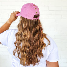 Load image into Gallery viewer, back view of pink messy bun baseball cap with gold snaps and curly long hair red sprite hats. barbie hat
