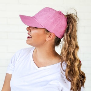 side view of red sprite hats pink messy bun baseball cap with curly high ponytail best hats ever. barbie hat