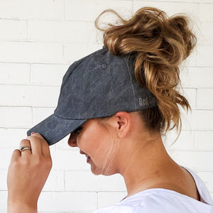 side view of relaxed fit dark grey messy bun baseball cap with high messy bun red sprite hats fast hairstyles