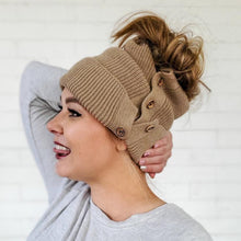 Load image into Gallery viewer, side view of red sprite hats light mocha button up beanie with high messy bun
